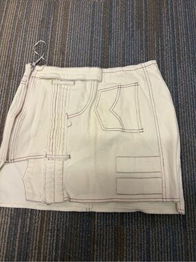 AKIRA Cream Mini Skirt with Black Logo Tag